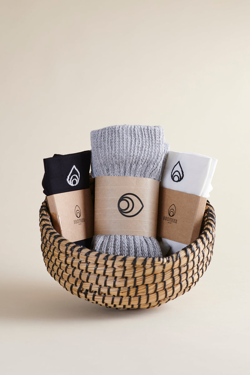 The Collegiate Bundle from Brother Vellies features one pair each of the Cloud Sock in grey, the Perfect Ankle Sock in Midnight, and the Perfect Ankle Sock in Lily