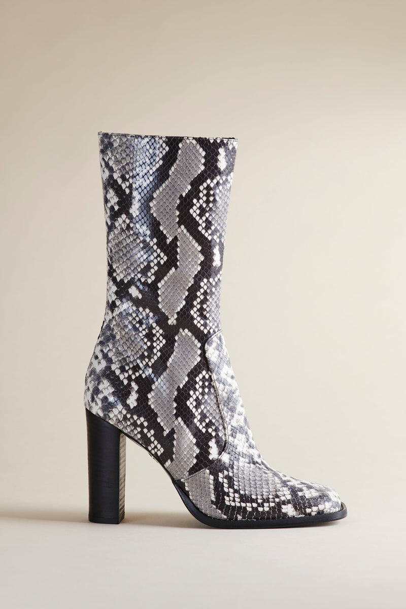 Brother Vellies Lauryn Boot in black & white faux snake leather with a 3" black heel, shown on a beige backdrop.