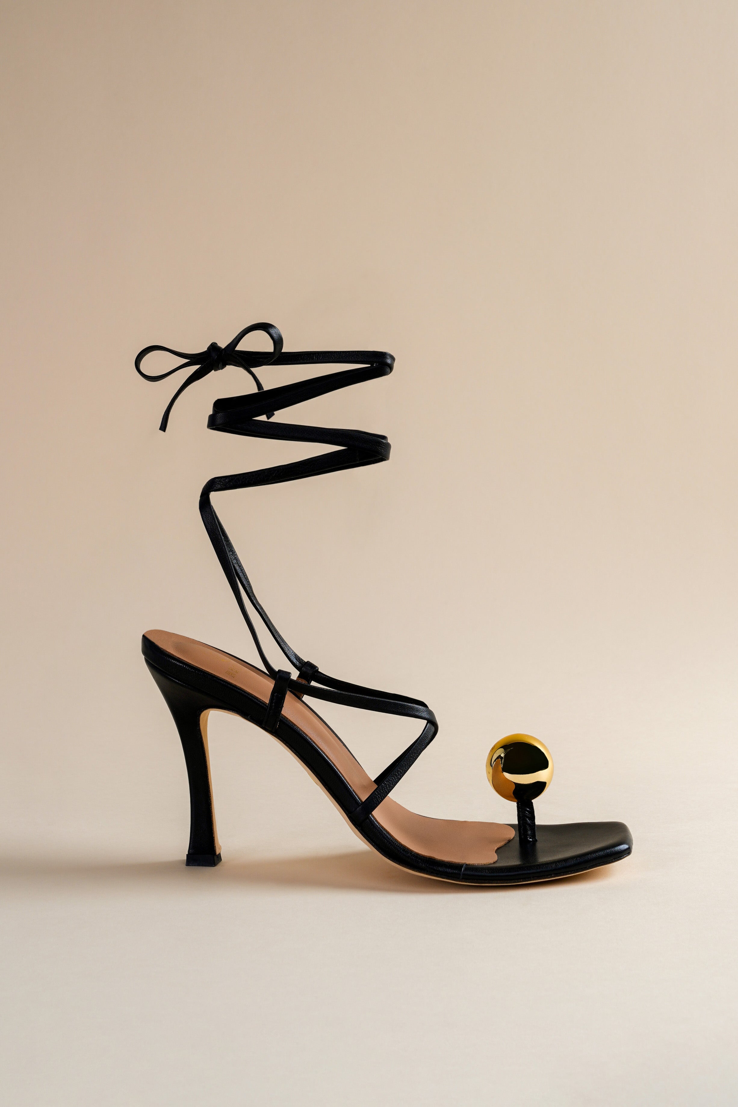 Globe sandal in black nappa leather and golden globe