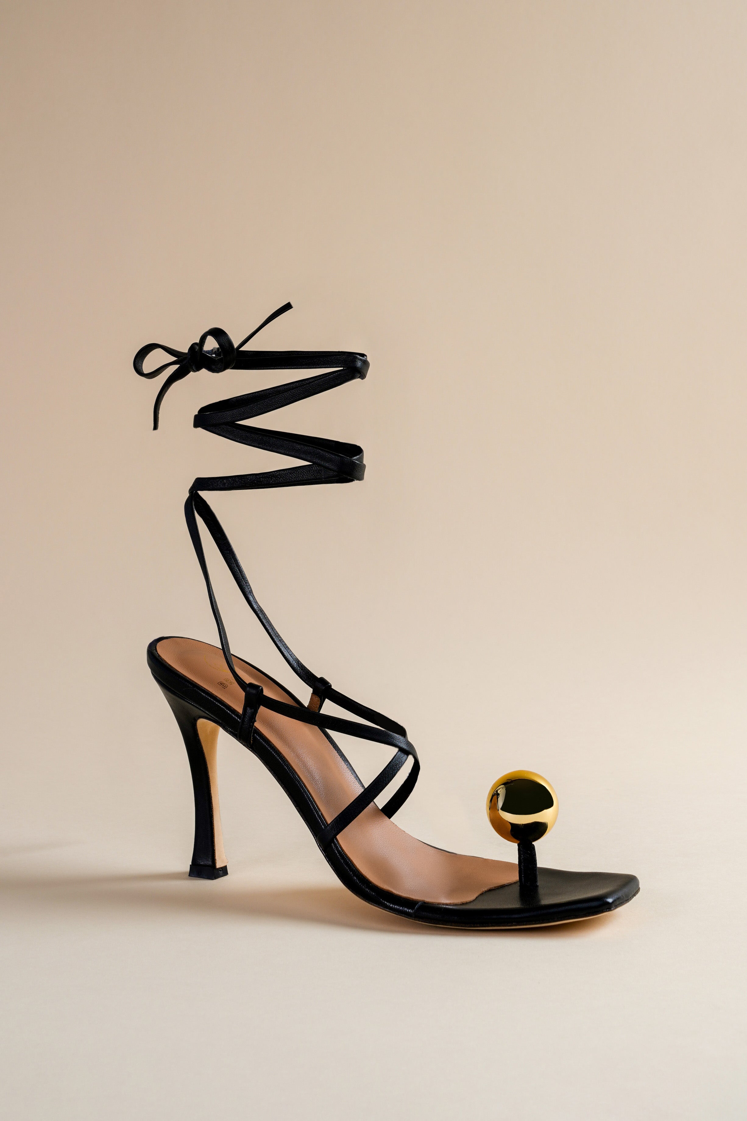 Globe sandal in black nappa leather and golden globe